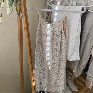 Super cute white lace mini dress with a nude slip! Size XS from Macys.